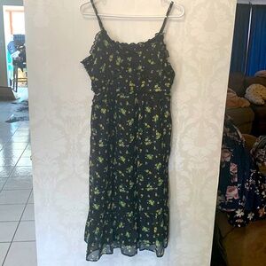 Spring spaghetti strap yellow floral and black dress. Is a midi dress. Like New